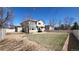 Spacious backyard with gravel and lawn with ample room for landscaping and recreation at 8024 W 95Th Way, Broomfield, CO 80021