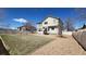 Fenced backyard with a lawn and gravel area, perfect for outdoor enjoyment at 8024 W 95Th Way, Broomfield, CO 80021