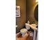 Half bath with a pedestal sink, toilet, and decorative wall art at 8024 W 95Th Way, Broomfield, CO 80021