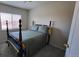 Cozy bedroom with a wooden framed bed and window bringing in natural light at 8024 W 95Th Way, Broomfield, CO 80021