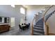 Dining room with a grand staircase, high ceiling, and natural light at 8024 W 95Th Way, Broomfield, CO 80021
