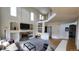 Inviting living room featuring a cozy fireplace and plenty of natural light at 8024 W 95Th Way, Broomfield, CO 80021