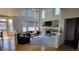 Spacious living room with fireplace, high ceilings, and ample natural light at 8024 W 95Th Way, Broomfield, CO 80021