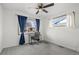 Bright bedroom with two windows and a built-in desk area, perfect for a home office at 1780 S Umatilla St, Denver, CO 80223