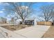 Charming single Gathering home showcasing its long driveway and pleasant neighborhood at 1780 S Umatilla St, Denver, CO 80223