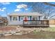 Charming single Gathering home with a bright red front door and a cozy front porch at 1780 S Umatilla St, Denver, CO 80223