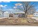 Charming single Gathering home with natural rock landscaping in the front yard at 1780 S Umatilla St, Denver, CO 80223