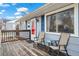 Cozy front porch with seating area, perfect for enjoying quiet moments outdoors at 1780 S Umatilla St, Denver, CO 80223