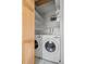 Convenient laundry room closet with washer, dryer, and ample shelving for storage at 1780 S Umatilla St, Denver, CO 80223