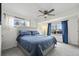 Inviting bedroom with a comfortable bed, neutral carpet, and natural light from two windows at 1780 S Umatilla St, Denver, CO 80223