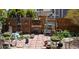 Cozy backyard area with brick patio, garden decor, and wooden fence at 14558 Vine St, Thornton, CO 80602