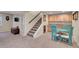 Finished basement featuring a kitchenette, carpet, and bonus seating area at 14558 Vine St, Thornton, CO 80602