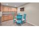 Finished basement with a kitchenette, dining area, and natural wood cabinets at 14558 Vine St, Thornton, CO 80602