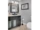 Stylish bathroom with a modern glass vessel sink and granite countertop vanity at 14558 Vine St, Thornton, CO 80602