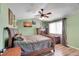 Comfortable bedroom with wood furnishings, ceiling fan, and coordinated decor at 14558 Vine St, Thornton, CO 80602