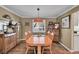 Inviting dining room with hardwood floors, vintage decor and a classic chandelier at 14558 Vine St, Thornton, CO 80602