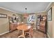 Charming dining room with wood floors, traditional furniture, and decorative lighting at 14558 Vine St, Thornton, CO 80602