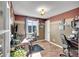 Bright office with hardwood floors, large window, and neutral two-tone walls at 14558 Vine St, Thornton, CO 80602