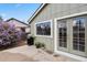 Back patio with a grill, plants, and sliding glass door, perfect for outdoor dining at 8174 Field Cir, Arvada, CO 80005