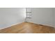 Well-lit bedroom with hardwood floors, window with blinds, and neutral paint at 8174 Field Cir, Arvada, CO 80005