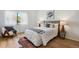 Cozy bedroom featuring a comfortable bed, stylish furnishings, and a well-lit window view at 8174 Field Cir, Arvada, CO 80005
