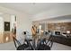 Dining area with a contemporary table and chairs positioned near the entryway and staircase at 8174 Field Cir, Arvada, CO 80005