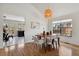 Inviting dining room with hardwood floors and modern light fixture at 8174 Field Cir, Arvada, CO 80005
