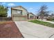 Two-story home with a large driveway, two-car garage, and well-maintained front yard at 8174 Field Cir, Arvada, CO 80005