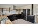 Contemporary kitchen featuring stainless steel appliances, floating shelves and modern cabinetry at 8174 Field Cir, Arvada, CO 80005