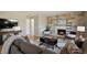 Inviting living room with stone accent wall, fireplace, and stylish furniture at 8174 Field Cir, Arvada, CO 80005