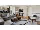 Bright living room with hardwood floors, television, and comfortable seating at 8174 Field Cir, Arvada, CO 80005