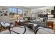 Spacious living room featuring a large window, comfortable seating, and stylish rug at 8174 Field Cir, Arvada, CO 80005