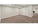 Finished basement with neutral carpet, closet, and recessed lighting for a versatile living space at 3338 W Arlington Ave, Littleton, CO 80123