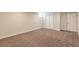Finished basement featuring neutral carpet and ample storage for versatile use at 3338 W Arlington Ave, Littleton, CO 80123