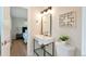 This bathroom has a floating vanity, modern fixtures, and bright lighting at 3338 W Arlington Ave, Littleton, CO 80123