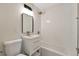 Clean bathroom featuring a vanity sink, white subway tile, and a shower-tub combination at 3338 W Arlington Ave, Littleton, CO 80123