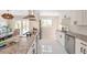 Modern kitchen featuring white cabinets, stainless steel appliances, and granite countertops for a sleek design at 3338 W Arlington Ave, Littleton, CO 80123