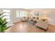 Bright living room featuring hardwood floors, a comfortable sofa, and a modern coffee table on a rug at 3338 W Arlington Ave, Littleton, CO 80123
