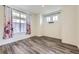 Cozy bedroom with hardwood floors, ample natural light, and a serene atmosphere, creating a peaceful retreat at 17530 E 95Th Ave, Commerce City, CO 80022