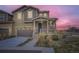 Charming home featuring a welcoming porch, well-manicured lawn, and attached garage, perfect for modern living at 17530 E 95Th Ave, Commerce City, CO 80022