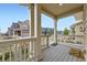 Covered porch featuring a cozy space, decorative railing, and neighborhood views, creating an inviting outdoor area at 17530 E 95Th Ave, Commerce City, CO 80022