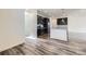 Open-concept kitchen featuring stainless steel appliances, a central island, and modern finishes, seamlessly connected to the living area at 17530 E 95Th Ave, Commerce City, CO 80022