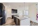 Modern kitchen featuring an island with granite countertops, stainless steel appliances, and pendant lighting at 17530 E 95Th Ave, Commerce City, CO 80022