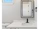 Bathroom with a clean white design and modern quartz countertop at 2317 S Galapago St, Denver, CO 80223