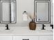 Bathroom featuring double sinks, quartz countertops and modern matte-black faucets at 2317 S Galapago St, Denver, CO 80223