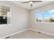 A bright bedroom with multiple windows and neutral carpet at 2317 S Galapago St, Denver, CO 80223