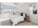 Bright bedroom featuring an outdoor balcony, neutral colors, and ample sunlight at 2317 S Galapago St, Denver, CO 80223