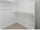 Walk-in closet with bright lighting and carpeted floor at 2317 S Galapago St, Denver, CO 80223
