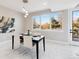Dining room with a modern chandelier, an outdoor view, and white marble floors at 2317 S Galapago St, Denver, CO 80223