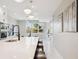 The kitchen features an island with seating, modern lighting, and stainless steel appliances at 2317 S Galapago St, Denver, CO 80223